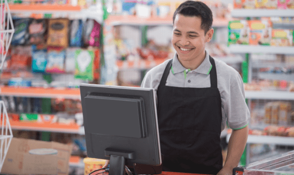 Retail staff using POS system for selling to upscaling